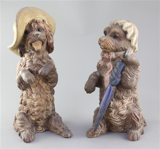 A pair of German or Austrian cold-painted terracotta figures of begging dogs, late 19th / early 20th century, 35.5cm and 32cm